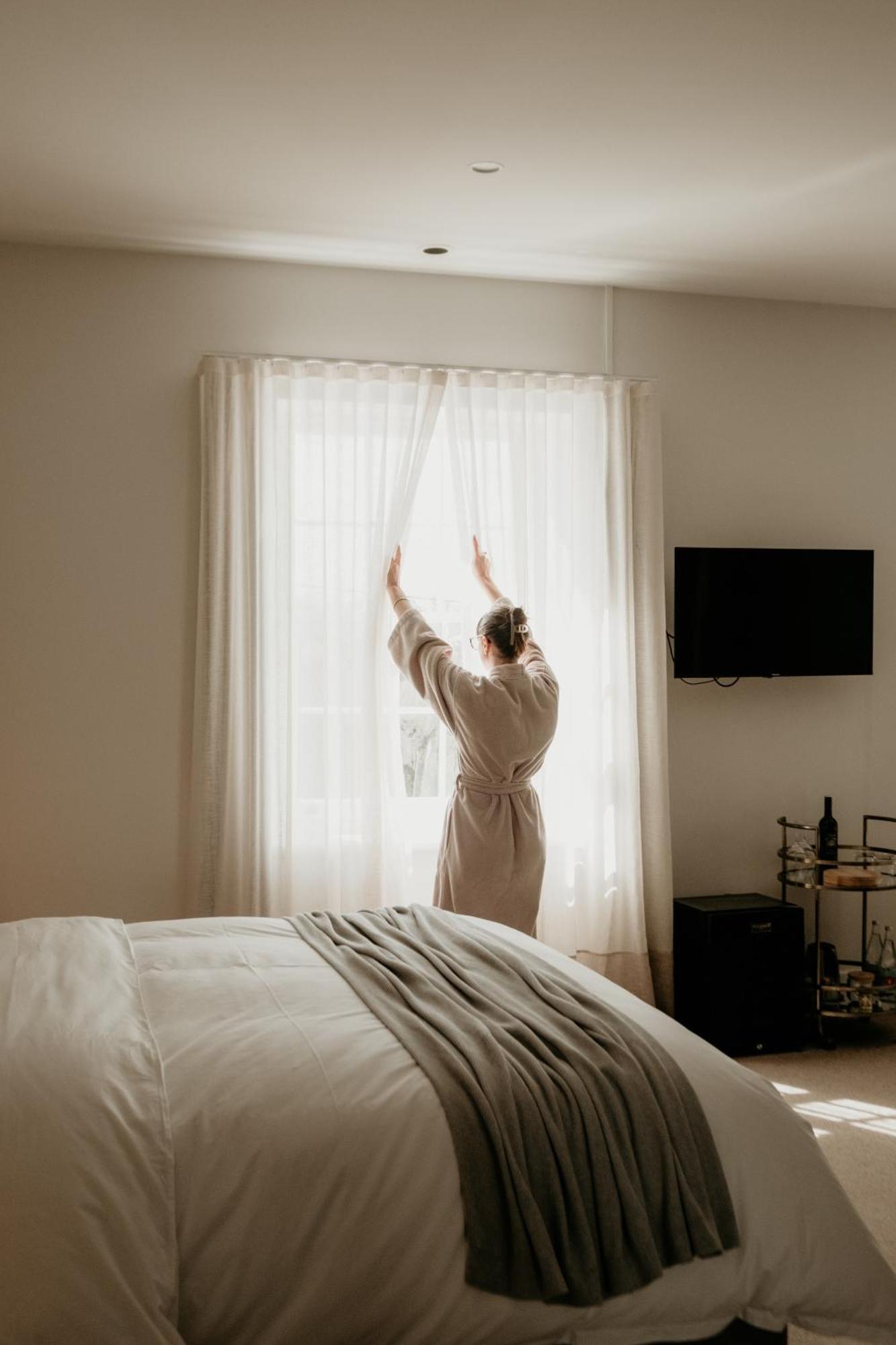 The Oak & Anchor Hotel Port Fairy Exteriör bild A woman opening the curtains in the morning